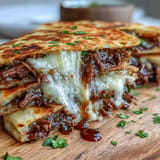 Cheesy, shredded beef quesadillas ready for a flavorful Cinco de Mayo feast.