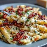 Vivid Marry Me Pasta, blanketed in velvety sauce, garnished with fresh basil.