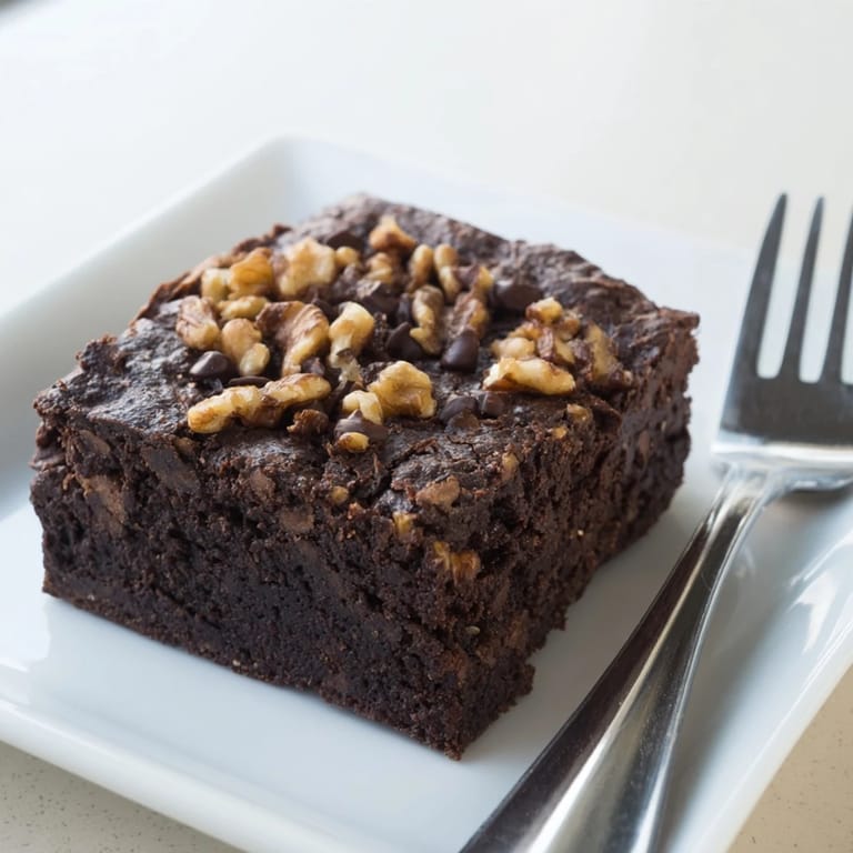 Warm, freshly baked brownies: the deep cocoa aroma and a delightful, melt-in-your-mouth chocolate bite.