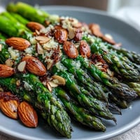 Bright lemon butter asparagus with crunchy almonds makes a perfect spring side dish for any dinner table.